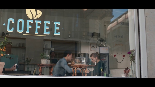 Video Reference: Snapshot, Advertising, Display window, Window, Urban area, Restaurant, Building, Signage, Font, Facade