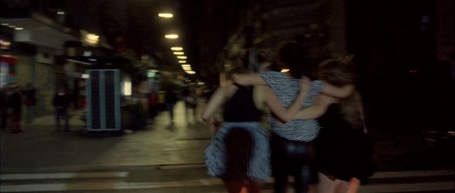 Video Reference: night, infrastructure, street, road, darkness, snapshot, girl, crowd, interaction, pedestrian, Person