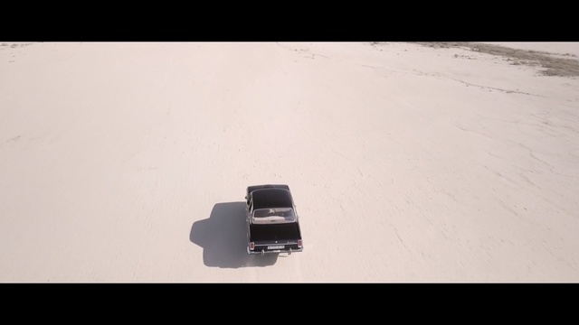 Video Reference: white, photograph, mode of transport, photography, sand, sky, line, shadow, landscape, font