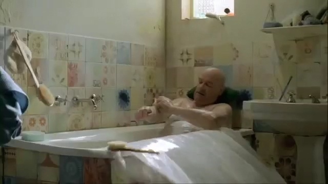 Video Reference: Bathroom, Bathtub, Bathing, Room, Tile, Plumbing fixture, Floor, Interior design, Flooring, Person