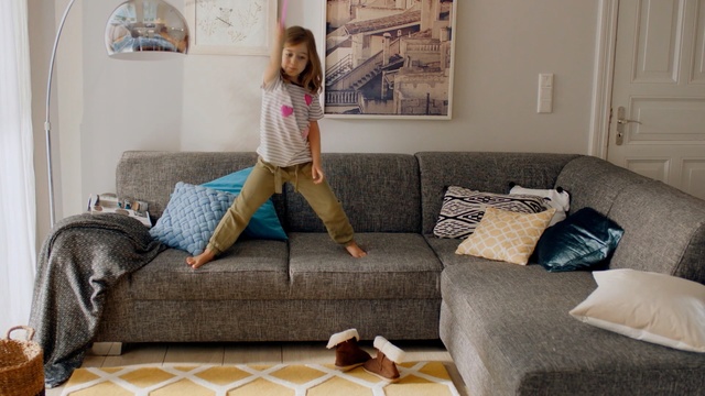 Video Reference: Floor, Furniture, Room, Couch, Living room, Bedroom, Bed sheet, Flooring, Comfort, Interior design