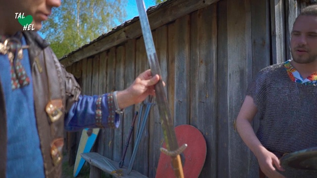 Video Reference: Art, Person, Outdoor, Building, Standing, Holding, Table, Cake, Man, Woman, Food, Front, Plate, Young, Carrying, Knife, Boy, Little, Cutting, Wearing, Wooden, Red, Old, Baseball, Umbrella, Pizza, Bat, White, Kitchen, Phone, Hat, Musical instrument, Violin, Cello