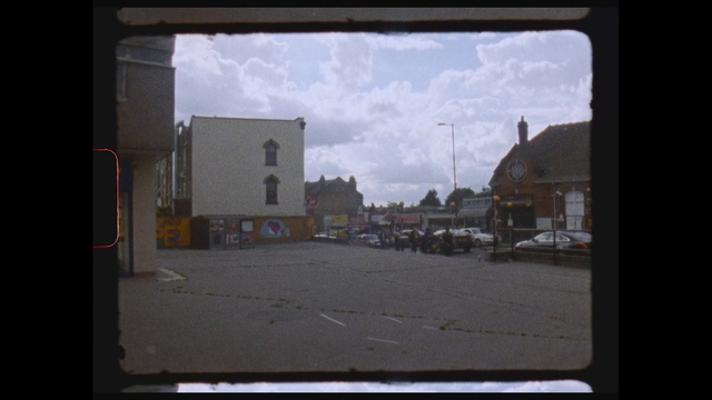Video Reference: Town, Sky, Window, Neighbourhood, Street, Residential area, Asphalt, House, Building, Road