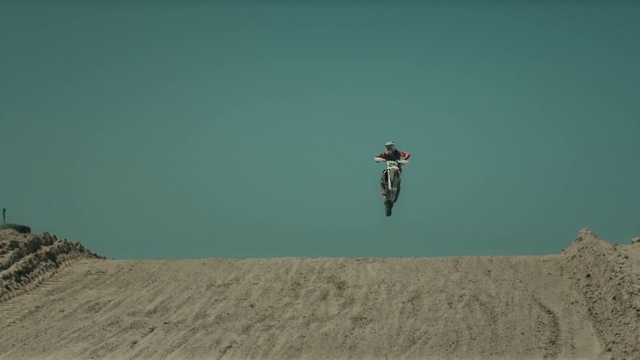 Video Reference: Green, Extreme sport, Freestyle motocross, Sand, Bicycle motocross, Flip (acrobatic), Vehicle, Bicycle, Recreation, Racing