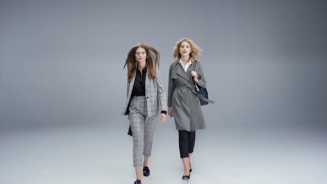 Video Reference: Clothing, Fashion model, White, Fashion, Shoulder, Outerwear, Coat, Standing, Jacket, Grey