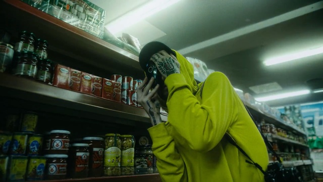 Video Reference: Green, Supermarket, Convenience store, Snapshot, Yellow, Outerwear, Jacket, Grocery store, Personal protective equipment, Retail