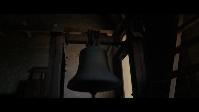 Video Reference: bell, hanging bell, interior, wooden beams, dark, shadowy, historic, architecture, church, tower, close-up, low light