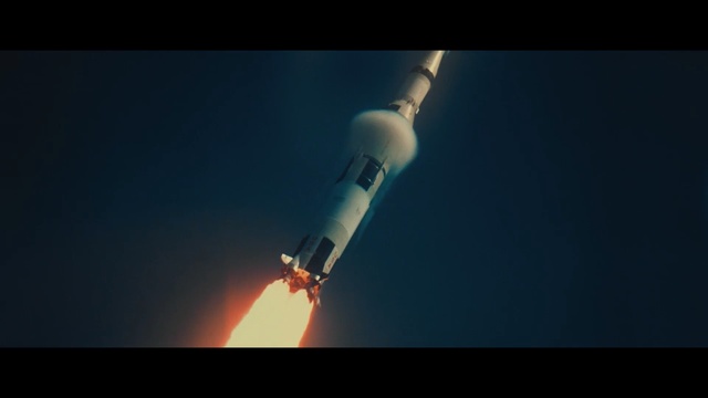 Video Reference: Rocket, Spacecraft, Space shuttle, Atmosphere, Sky, Vehicle, Space, Heat, Dark, Man, Light, Large, Airplane, Holding, Flying, White, Air, Plane, Television, Standing, Blue, Red, Room, Night, Screenshot, Flight