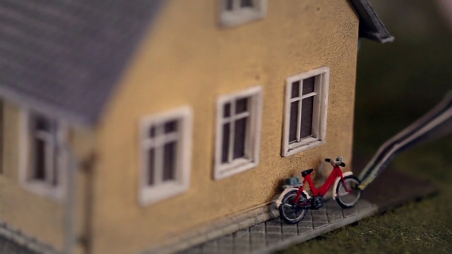 Video Reference: House, Property, Scale model, Wall, Vehicle, Home, Facade, Building, Bicycle, Real estate