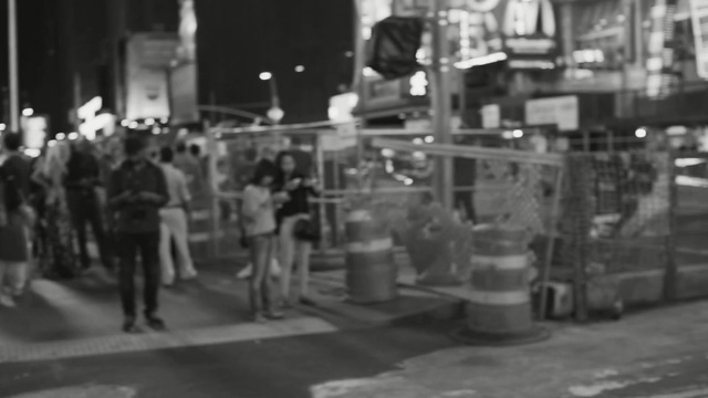 Video Reference: urban area, people, crowd, black and white, monochrome photography, pedestrian, street, metropolis, infrastructure, mode of transport, Person