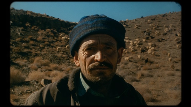 Video Reference: Human, Adaptation, Headgear, Facial hair, Smile, Moustache, Photography, Screenshot, Portrait, Landscape