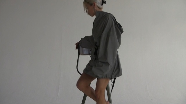 Video Reference: Shoulder, Standing, Joint, Outerwear, Arm, Leg, Knee, Human body, Sleeve, Human leg