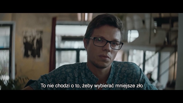 Video Reference: Eyewear, Glasses, People, Cool, Forehead, Movie, Cheek, Chin, Photo caption, Snapshot, Person, Indoor, Man, Looking, Window, Photo, Front, Laptop, Sitting, Table, Using, Wearing, Holding, Computer, Food, Screen, Close, Large, Glass, Head, Shirt, Woman, Standing, White, Screenshot, Human face, Text, Face, Portrait, Clothing