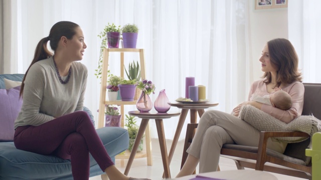 Video Reference: Living room, Room, Furniture, Sitting, Purple, Interior design, Conversation, Leg, Table, Comfort