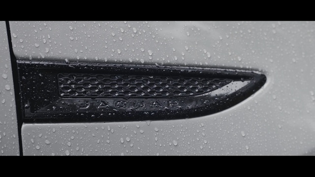 Video Reference: Black, Automotive exterior, Bumper, Vehicle door, Photography, Black-and-white, Automotive design, Material property, Grille, Font