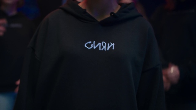 Video Reference: T-shirt, Hoodie, Black, Outerwear, Clothing, Product, Hood, Sleeve, Fashion, Top