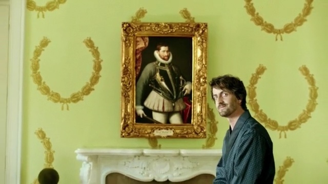 Video Reference: religion, wall, picture frame, art, molding, interior design, Person