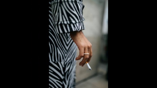 Video Reference: Street fashion, Black-and-white, Fashion, Dress, Photography, Hand, Waist, T-shirt, Outerwear, Shoe