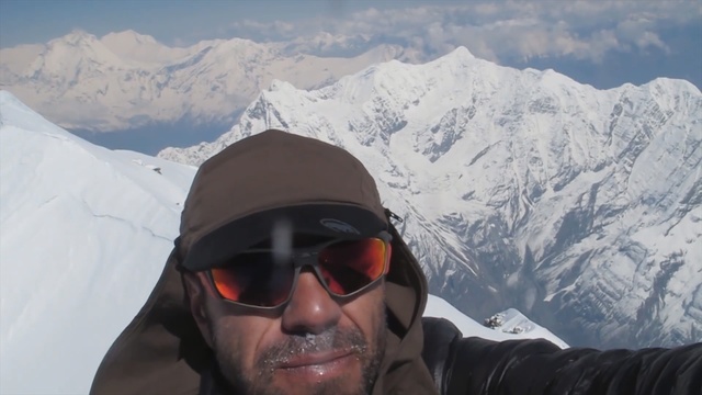 Video Reference: mountainous landforms, mountain range, mountain, mountaineer, mountaineering, ridge, headgear, adventure, sunglasses, geological phenomenon