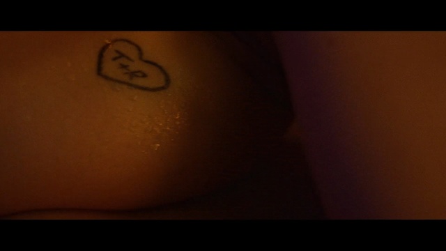 Video Reference: Tattoo, Nose, Brown, Close-up, Flesh, Design, Arm, Mouth, Macro photography, Font