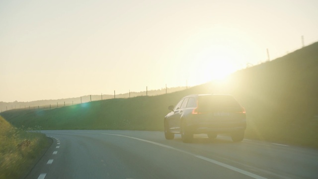 Video Reference: Road, Atmospheric phenomenon, Mode of transport, Sky, Yellow, Highway, Morning, Road trip, Freeway, Haze