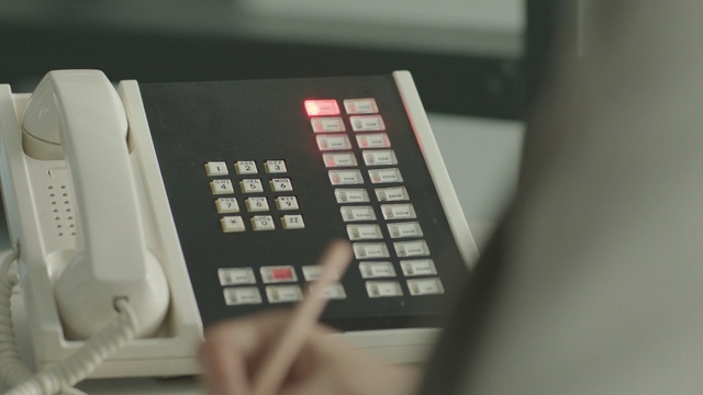 Video Reference: product, electronic device, telephony, technology, electronics, product, office equipment, Person
