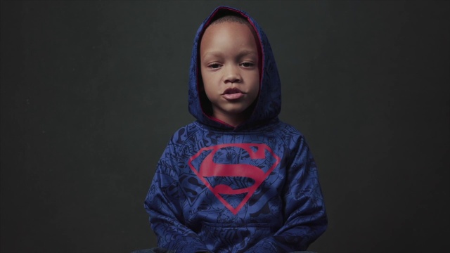 Video Reference: Face, Blue, Head, Outerwear, Cheek, Hoodie, Human, Portrait, T-shirt, Smile