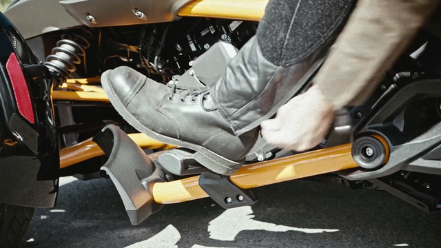 Video Reference: Motor vehicle, Footwear, Yellow, Vehicle, Auto part, Shoe, Leg, Wheel, Car, Person