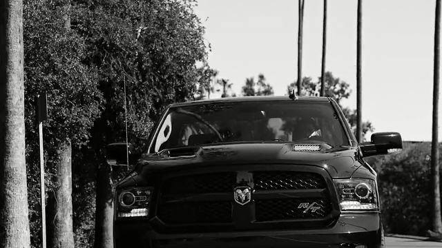 Video Reference: car, motor vehicle, land vehicle, black, vehicle, reflection, automotive design, black and white, transport, road