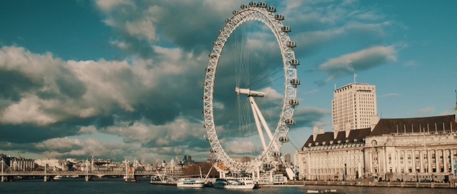 Video Reference: sky, landmark, cloud, tourist attraction, water, daytime, ferris wheel, reflection, city, sea