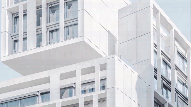 Video Reference: building, architecture, commercial building, facade, condominium, corporate headquarters, mixed use, daytime, apartment, window