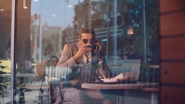Video Reference: Snapshot, Sitting, Glasses, Eyewear, Window, Photography, Reflection, Smoking, Vision care, Street, Person