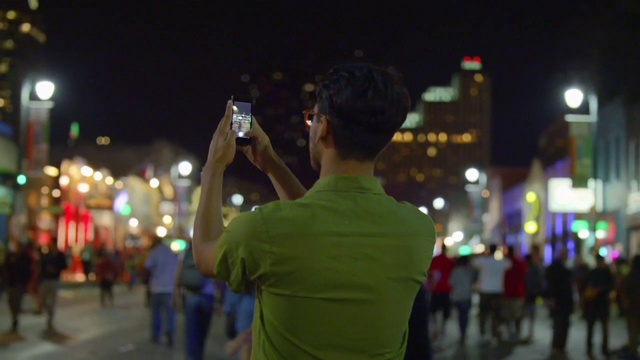 Video Reference: Night, Photograph, People, Green, Crowd, Light, Metropolitan area, Snapshot, Lighting, Standing, Person
