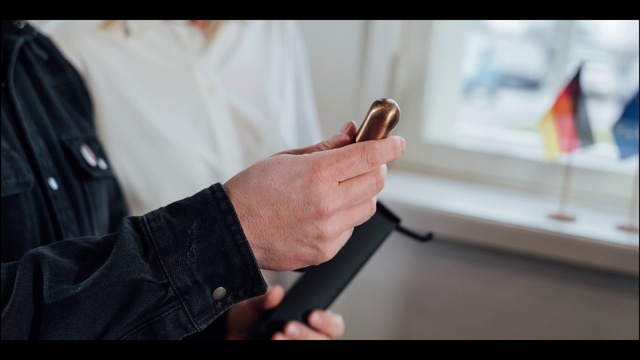 Video Reference: Hand, Finger, Wrist, Technology, Gadget, Leather, Smartphone, Electronic device, Mobile phone, Fashion accessory