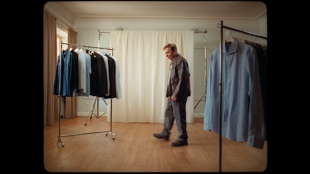 Video Reference: Clothes hanger, Room, Outerwear, Boutique, Home accessories, Wardrobe, Furniture, Costume design, Fashion design, Person