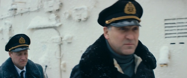 Video Reference: Military uniform, Military person, Headgear, Cap, Uniform, Military, Official, Person, Outdoor, Building, Snow, Man, Wearing, Hat, Skiing, Riding, Holding, Jacket, Street, Young, Standing, People, Black, Woman, Boy, Dressed, City, Walking, Hill, Group, Slope, White, Phone, Human face, Clothing, Fashion accessory, Goggles, Glasses