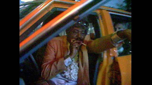 Video Reference: , Person, Indoor, Man, Woman, Mirror, Cellphone, Looking, Phone, Window, Standing, Front, Sitting, Holding, Glasses, Reflection, Wearing, Table, Glass, Talking, Girl, Young, Room, People, Playing, Human face, Clothing, Text