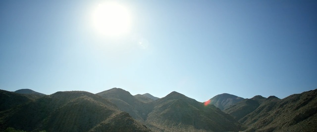 Video Reference: Mountainous landforms, Sky, Highland, Mountain, Mountain range, Ridge, Hill, Daytime, Light, Atmospheric phenomenon