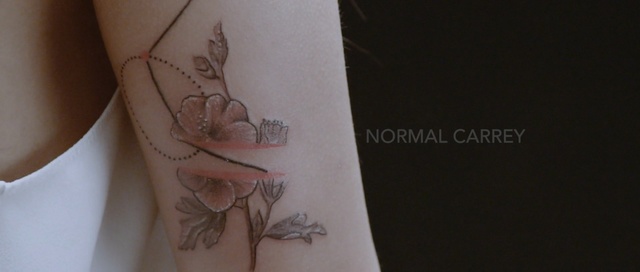 Video Reference: shoulder, joint, tattoo, temporary tattoo, arm, design, hand, pattern, finger, neck, Person