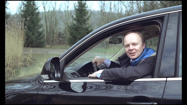 Video Reference: car, motor vehicle, vehicle, vehicle door, mode of transport, family car, automotive design, driving, automotive exterior, windshield, Person