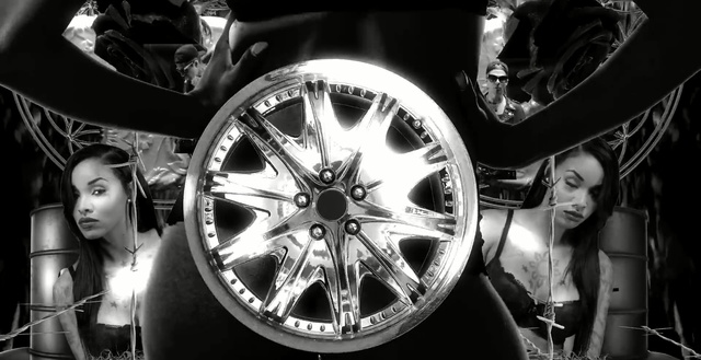 Video Reference: wheel, rim, spoke, black and white, motor vehicle, alloy wheel, tire, automotive tire, photography, automotive wheel system, Person