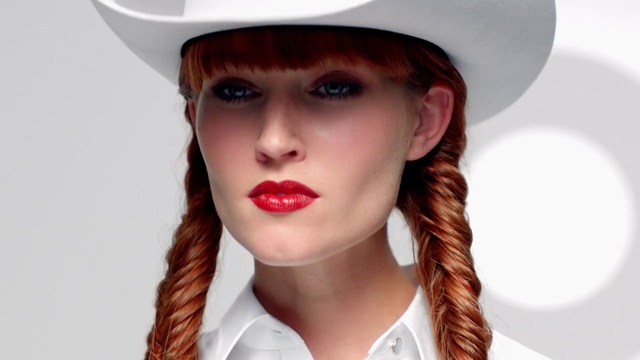 Video Reference: Hair, Lip, Hat, Clothing, Beauty, Chin, Headgear, Cowboy hat, Costume hat, Fashion accessory