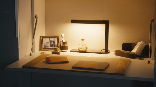 Video Reference: furniture, room, table, desk, interior design, living room, office, daylighting, Person