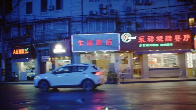 Video Reference: car, metropolitan area, mode of transport, city, light, street, electronic signage, night, downtown, signage