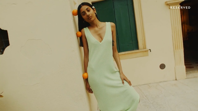Video Reference: Shoulder, White, Clothing, Dress, Joint, Arm, Yellow, Fashion, Waist, Neck, Person