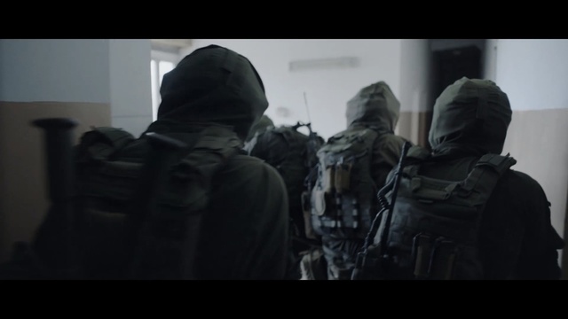 Video Reference: People, Military, Soldier, Army, Outerwear, Troop, Headgear, Military organization, Photography, Jacket, Indoor, Man, Looking, Room, White, Door, Black, Standing, Mirror, Holding, Woman, Large, Living, Bed, Clothing, Screenshot, Person, Weapon