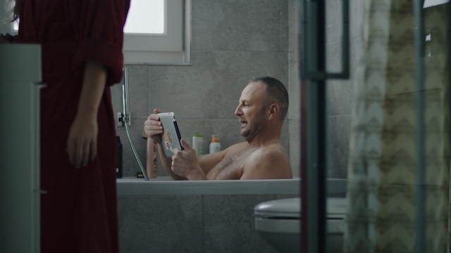 Video Reference: Bathing, Barechested, Water, Muscle, Room, Shower, Reflection, Window, Plumbing fixture, Person