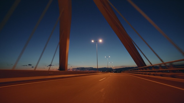 Video Reference: sky, infrastructure, road, horizon, fixed link, atmosphere, bridge, light, night, dusk
