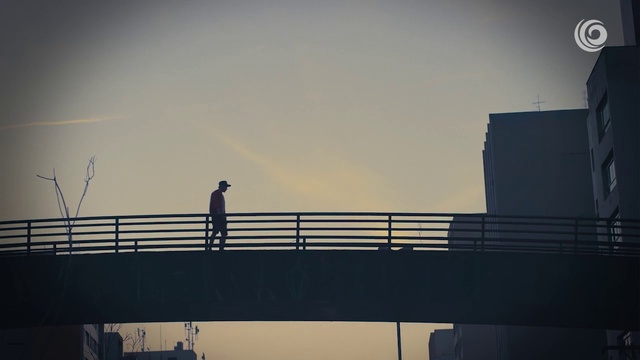 Video Reference: Sky, Bridge, Cloud, Architecture, Guard rail, Overpass, Photography, City, Nonbuilding structure, Fixed link, Person