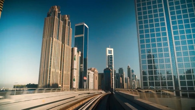 Video Reference: Metropolitan area, Skyscraper, Daytime, Urban area, Metropolis, City, Tower block, Cityscape, Landmark, Sky, Person